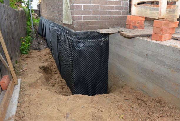 SJ Waterproofing Pros technician performing targeted Exterior Waterproofing assessment in Corunna, MI